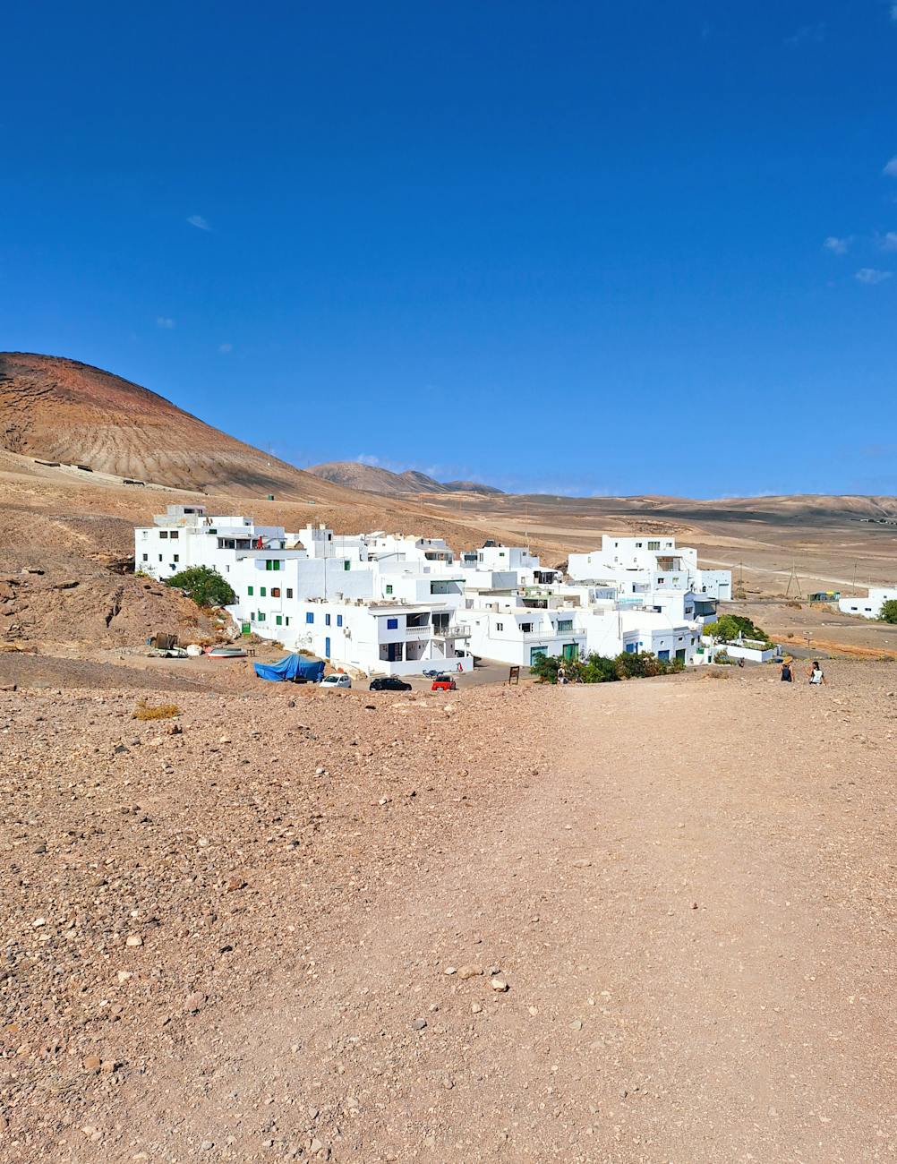 whitewashed village in arid desert landscape